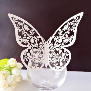 Elegant white laser-cut butterfly card decoration for wine glasses at wedding events
