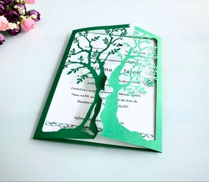 Detailed laser-cut tree design on green business wedding invitation card with inner sheet