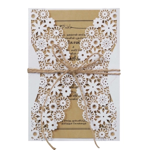 Laser cut hollow wedding invitation with white kraft paper and decorative twine detail