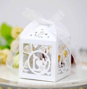 Elegant white laser-cut LOVE candy box with white ribbon for wedding gifts