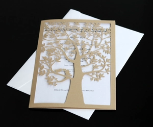 Laser-cut tree design wedding invitation with brown outer card and white envelope