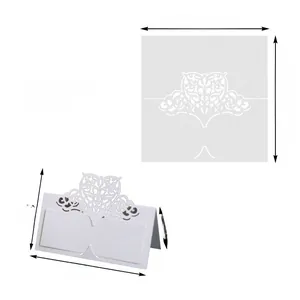 Macro view of laser-cut wedding place card showing dimensions for flat and folded states