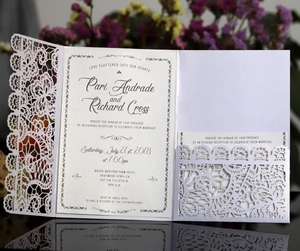 Elegant laser cut pearl beige lace wedding invitation with intricate floral pocket design