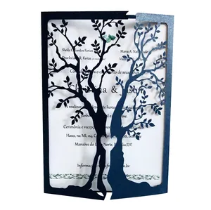 Close-up of laser-cut Tree of Life hollow design on navy blue wedding invitation