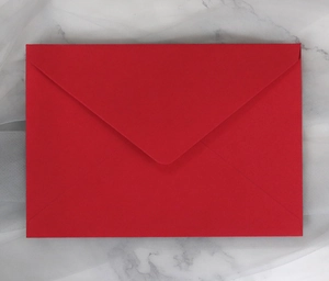 Detailed view of premium red rectangular envelope with a classic V-shaped flap closure