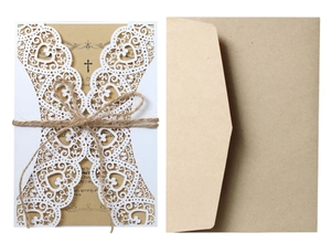 Laser cut white heart wedding invitation set with kraft paper inserts and jute twine