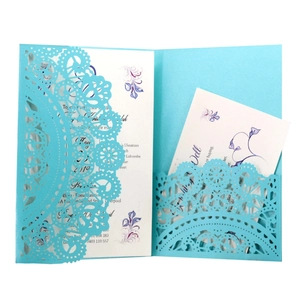 Laser cut lake blue wedding invitation with lace floral pattern and white inner card