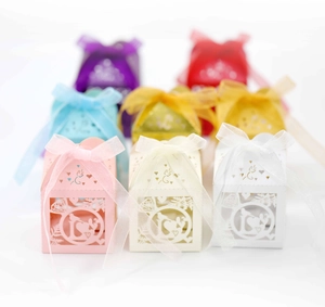 Laser-cut 'LOVE' hollow wedding candy boxes with ribbons in various colors