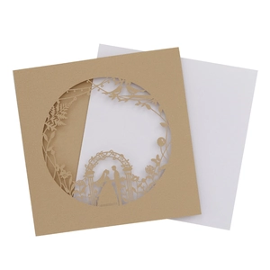 Detail of laser-cut wedding silhouette on kraft paper invitation card set