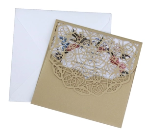 Detailed laser-cut hollow wedding invitation set with floral card and white envelope