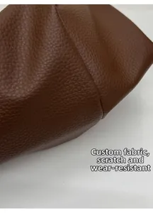 Close-up of durable lychee grain leather stitching on a vintage dark brown tote bag