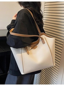 Minimalist beige tote bag with brown trim and lychee texture for chic daily commuting