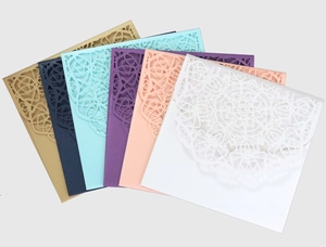 Detail of laser cut lace wedding invitations in six elegant assorted colors