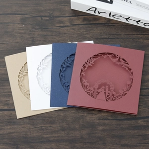 Detailed laser-cut wedding invitations with elegant bride and groom silhouette in four colors