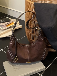Brown suede hobo shoulder bag with white contrast stitching and gold hardware detail