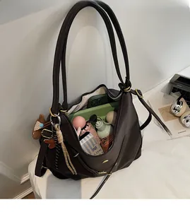 Top view showing large capacity and organized interior of dark brown leather tote bag