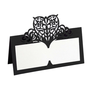 Laser cut black heart table place card with white blank space for wedding names