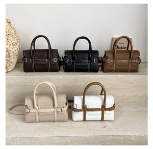 Litchi pattern leather bowling bags shown in five colors with strap detail