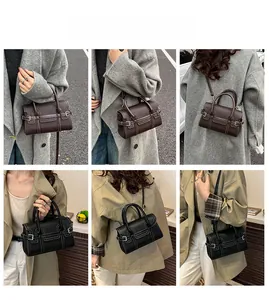 Detailansicht der Mini-Lederhandtasche in Kaffee und Schwarz mit Kontrastnähten
