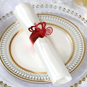 Detailed laser-cut red paper napkin ring in carriage design for wedding table decor