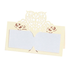 Detailed laser-cut heart place card in cream white paper for wedding table decor