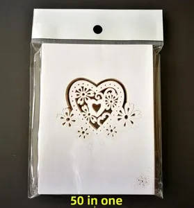 Pack of 50 laser-cut white heart and floral place cards inside transparent packaging