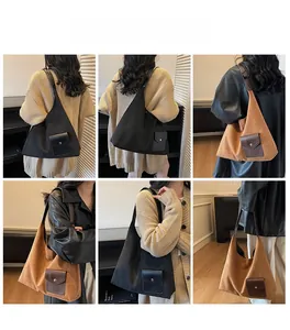 Viste dettagliate di una grande borsa tote scamosciata con pratica tasca frontale esterna