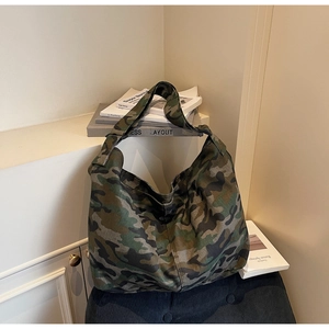 Close-up of durable camouflage canvas tote bag with thick shoulder strap for daily use