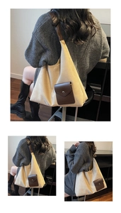 Detail view of large canvas hobo bag with vintage brown leather front pocket and metal snap