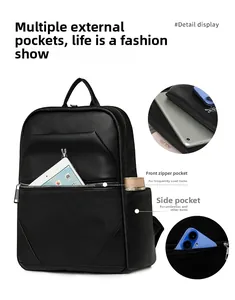 Detail view of large capacity black pebbled leather backpack with multi-pocket design