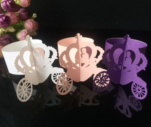Detailed laser-cut pumpkin carriage cupcake wrappers in white, pink and purple tones