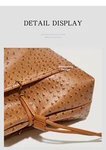 Detailed macro view of the drawstring design and ostrich leather texture on a brown tote bag