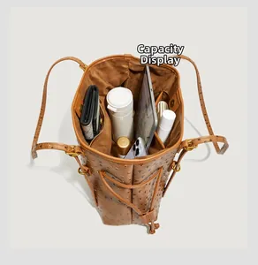 Large capacity display of the ostrich pattern tote bag interior with everyday essentials
