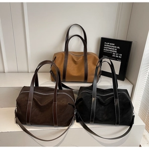 Detailed comparison of large travel bags in caramel, dark brown, and black colors