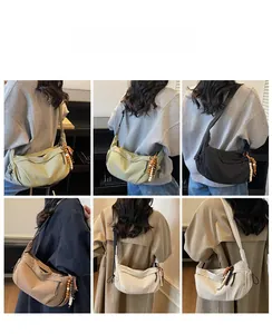 Detail shots of nylon crescent crossbody bags in multiple colors with beaded charms