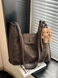 Brown large capacity hobo tote bag in soft suede finish with a cute bear charm