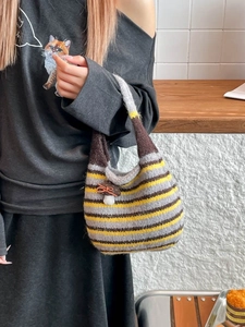 French style striped knit bucket bag with cute mushroom charm on hand for commuting