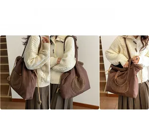 Detail view of large dark brown suede tote bag featuring fuzzy lamb wool front pocket