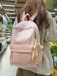Sac à dos d'école en nylon rose à motif d'étoiles avec un pendentif lune en peluche