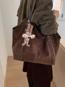 Brown suede tote bag with large capacity and cartoon bunny pendant for casual daily use