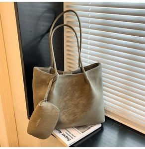 Detailed view of olive green oversized tote bag with matching zippered coin purse