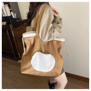 Brown suede tote bag with white faux shearling apple patch and fleece trim details