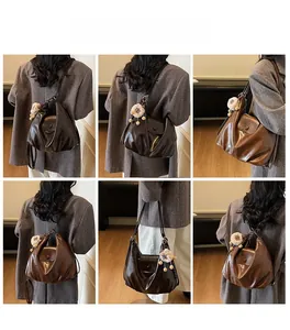 Detailed views of a dark brown faux leather hobo bag with a cute lamb charm pendant