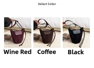Three suede bucket bags in wine red, coffee, and black with logo buckle and drawstrings