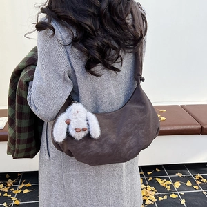 Deep brown large hobo shoulder bag with a cute white rabbit plush keychain detail
