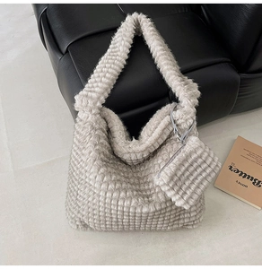 Detailed close-up of plush tote bag showing checkered faux fur texture and matching pouch