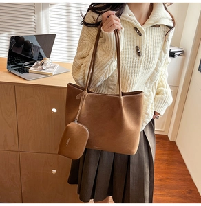 Brown matte tote bag shown with matching mini pouch in a cozy office setting