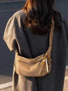 Minimalist nylon dumpling shoulder bag in khaki with decorative beads for women