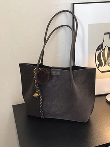 Large capacity vintage tote bag in dark grey suede with plush ball charm and top handles