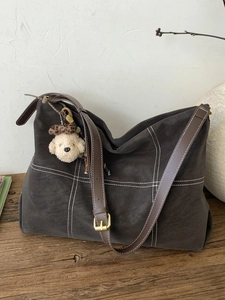 Chic frosted checkerboard tote bag in dark grey with puppy charm and leather strap